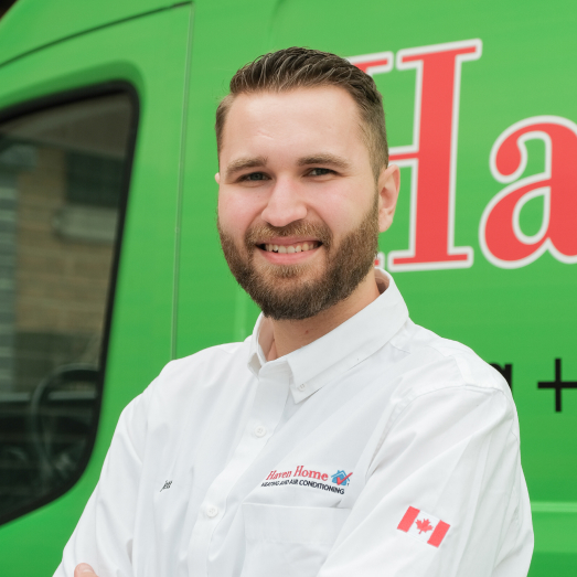 Haven Home technician standing by our famous green trucks in a residential neighbourhood. Haven Home technician standing by our famous green trucks in a residential neighbourhood.
