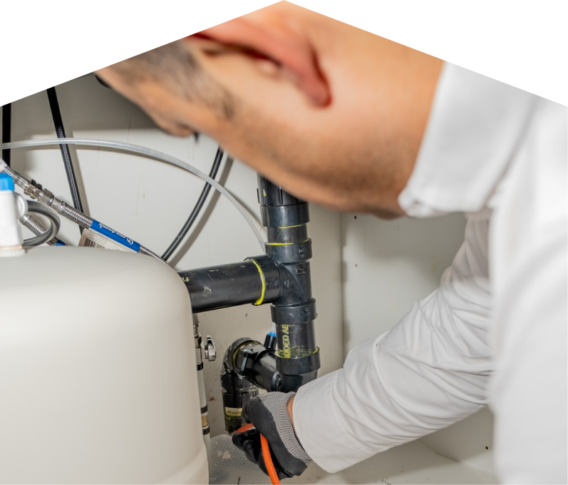 A Haven Home plumbing specialist uses a hydro jet to clear a clogged drain. A Haven Home plumbing specialist uses a hydro jet to clear a clogged drain.